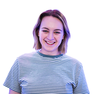 A photograph of CHAOS Radio presenter Meah Howlett; she is wearing a black and white striped tshirt.